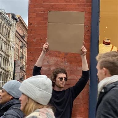 man-holding-cardboard-sign